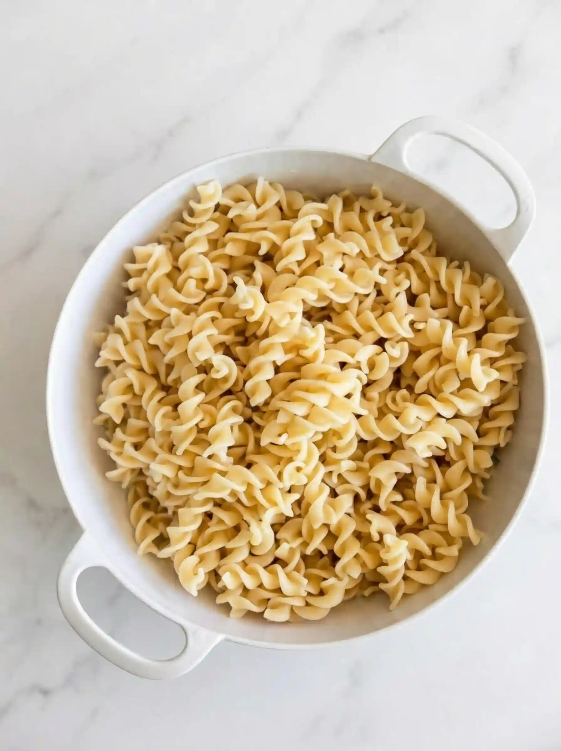 Cooked rotini pasta drained and rinsed under cold water for pesto pasta salad