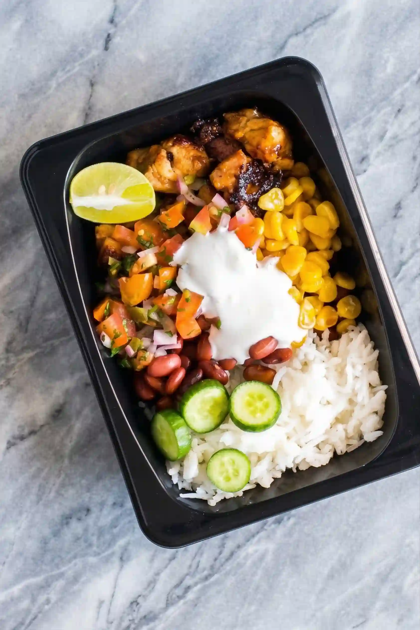 Finished Chicken Burrito Bowl Meal Prep Bowl Closeup chicken burrito bowl meal prep cilantro lime rice chicken toppings