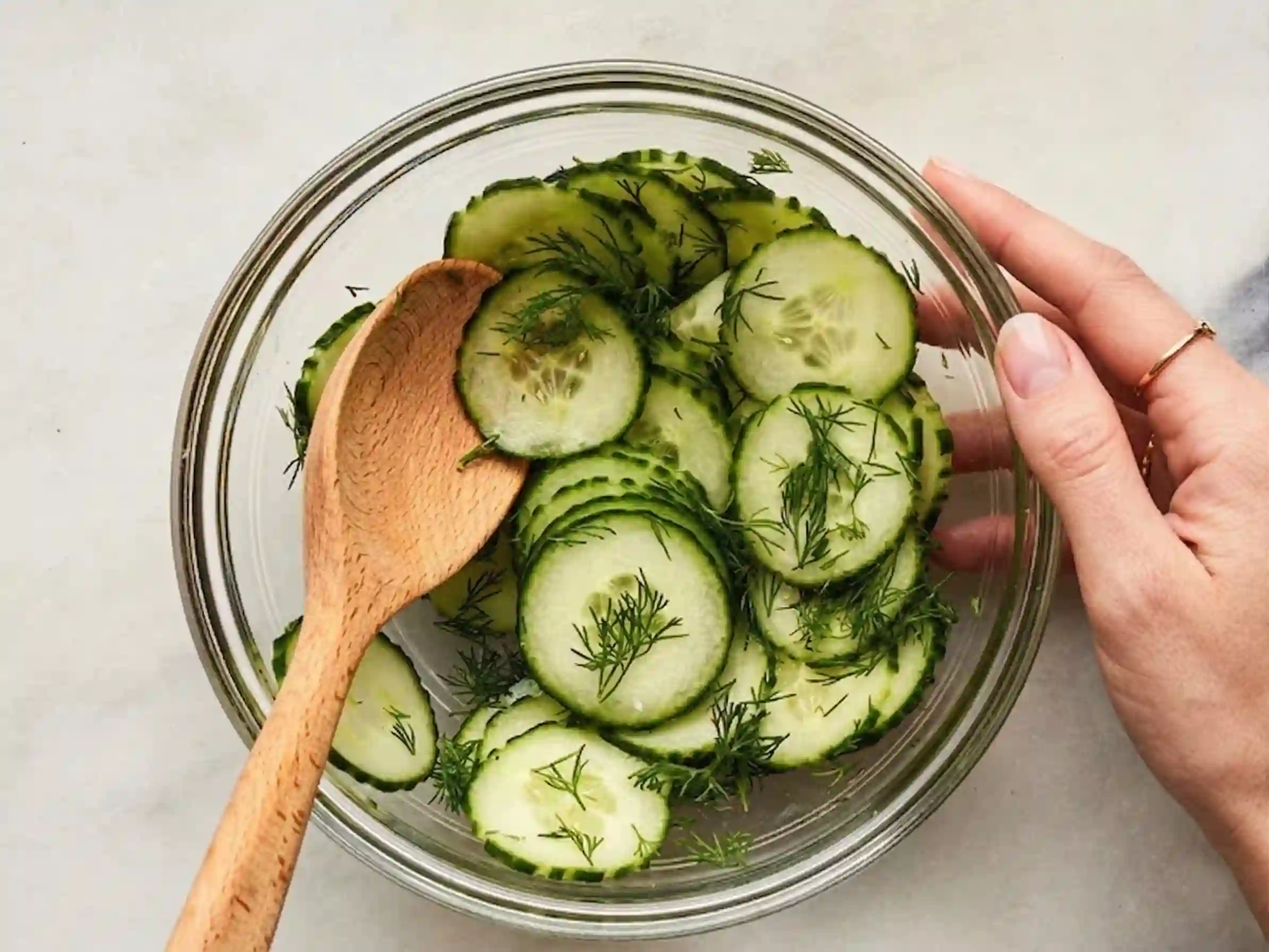 cottage-cheese-cucumber-sandwich-ingredients Ingredients for cucumber cottage cheese sandwich including cottage cheese, cucumber, dill, lemon and bread