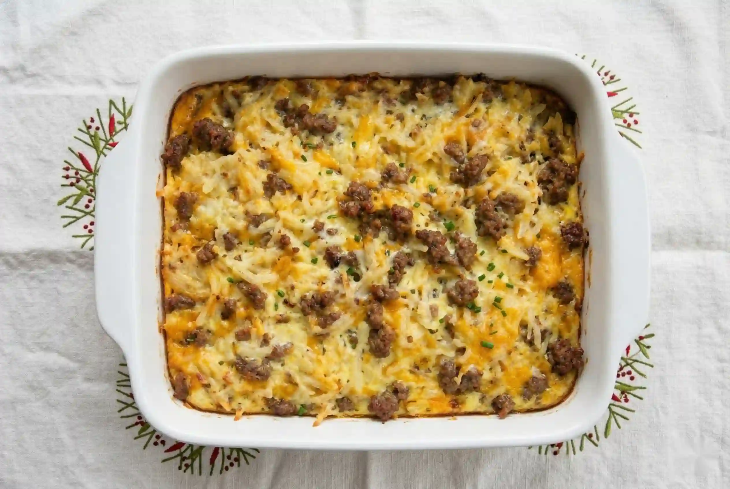 Sausage and egg casserole ingredients flatlay wood board