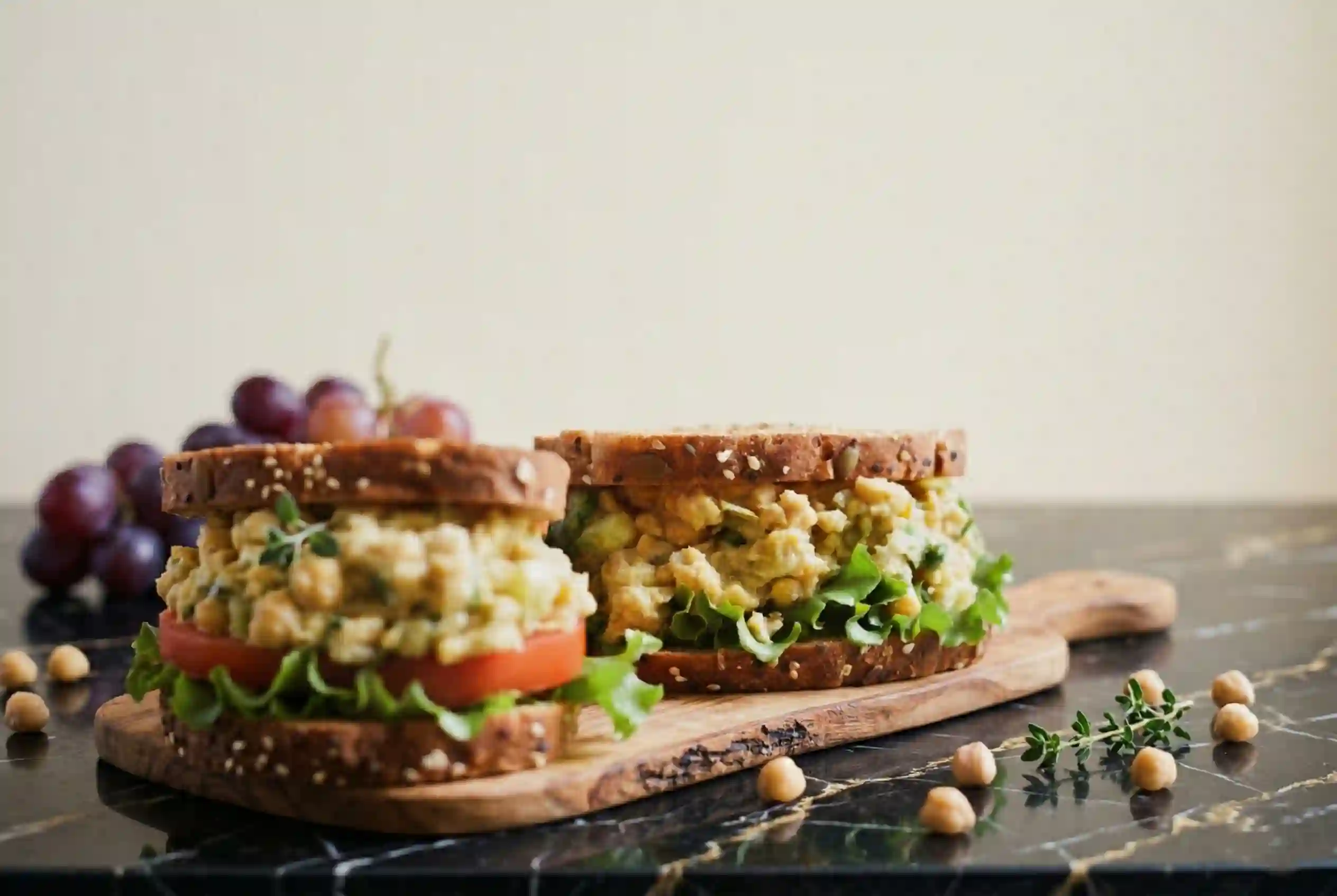 vegan-sandwich-meal-prep Vegan chickpea salad sandwiches wrapped for lunch with side veggies